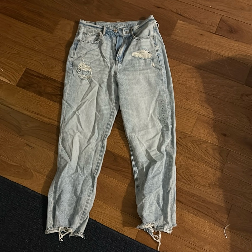 light blue, distressed, never worn the tag is not on there, but the sticker is